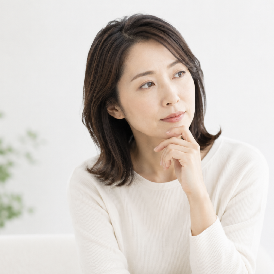 原因がはっきりしない不調について悩む女性のイメージ